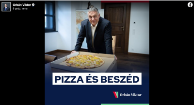 Premier Węgier nad pudełkiem z pizzą